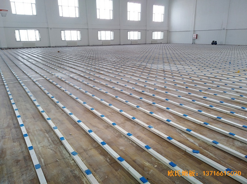 新疆克拉玛依消防大队篮球馆体育木地板铺装案例1